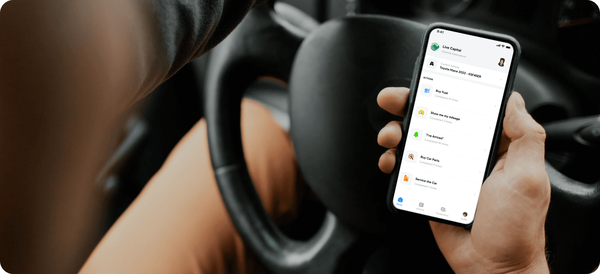Driver holding a phone with the BetaDriva app open, showing actions to buy fuel, record mileage, check in on arrival, buy car parts and service the car